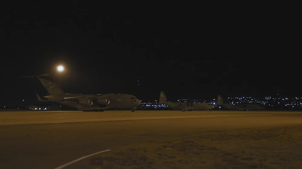 Official video frame of military aircraft on the airfield at night