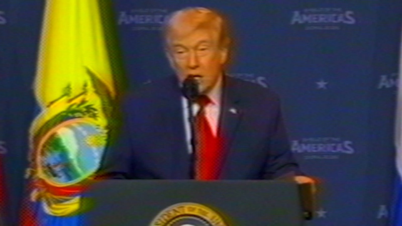 Official video preview: Donald Trump speaks into a microphone at the summit lectern.